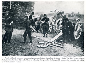 This photo taken in early World War I has the caption: French artillery in action, the gunners