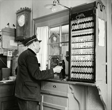 Oldest railway employee at the client counter, 1946.