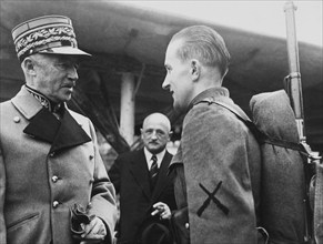 General Henri Guisan congratulates the winner of the army competition march of Frauenfeld, 1940.