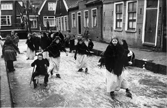 People ice skating in Holland, 1955.