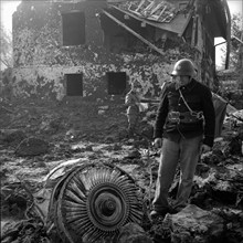 Caravelle crash Durrenasch 1963: fireman looking at remains at the scene of the accident.