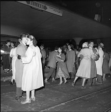 Zurich Festival 1953; couples dancing on the tramway rails at Bellevue.