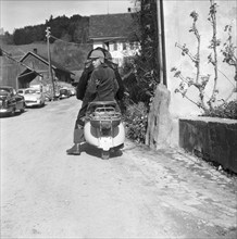 Boy sitting on a Vespa, TG 1960.