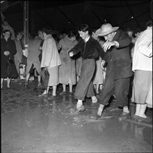 Zurich Festival 1953; water and mud in marquee after heavy rainfall.