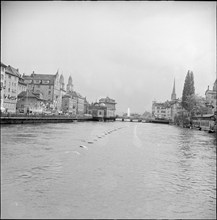 Zurich Festival 1953; fountain in the distance, Limmat river.