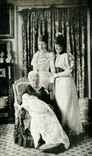 This images shows Her majesty Queen Victoria with the Baby Prince and the Princess Alexandra of