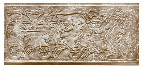 This marble slab shows the horse in warfare. The royal figure is Assyrian king Ashurnasirpal II