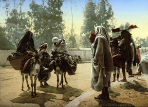 Bedouins with donkeys, group in front of Bab Aleona, Tunisia, around 1895, historical, digitally