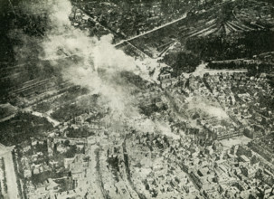 The caption reads: Remarkable photo of the Germans burning Reims, Incendiary shells can be seen