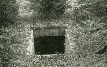 The caption reads: Underground passage through which the Ex-Kaiser fled to Holland. The Ex-Kaiser