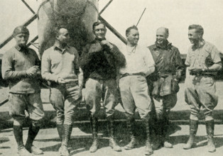 These photos dates to 1924. The caption reads: The First Men to Fly Around the World. In the upper