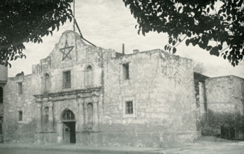 This photos dates to the 1920s. Its caption reads: The Texas Cradle of Liberty.  The Alamo, at San