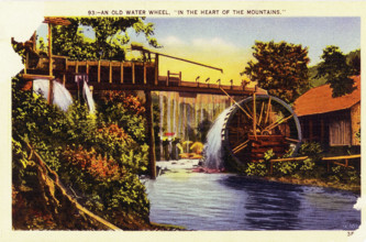 Pictured in this early 1930s postcard is an old water wheel in the ""heart of the mountains"" in