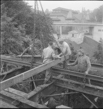 Construction worker demolishing a railway bridge 1941.