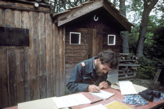 Soldier registering carrier pigeons, 1984.