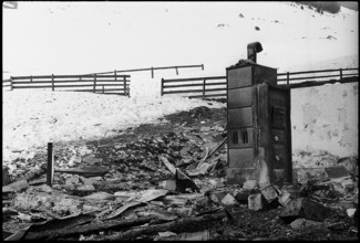 Remains of a fire burning down the alp restaurant Frakmunt; stove 1969.