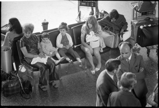 Tourists at airport Zurich-Kloten 1971.