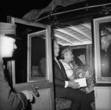 Horst Wolfram Geissler, left, in a stage coach, stagecoach.