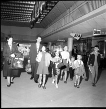 Gerold Zust with Hungarian children at airport Kloten 1957.