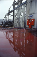 Fire Schweizerhalle 1986: fire hose case at a destroyed warehouse.