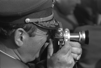 Swiss Army Parade; Officer taking photographs 1972.