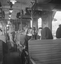 Nurses in a train; 1939.