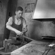 Forge, nailer making nails; 1940.