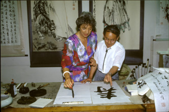 Catherine Delamuraz with calligrapher in China 1992.