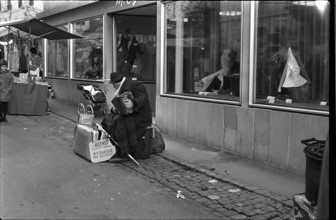 Blind man playing accordion on the street 1969.