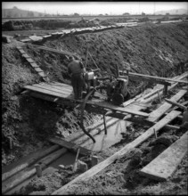 Farmland improvement in Rheintal 1949: drainage canal.