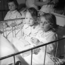 Santa Claus visits sick children; 1958.