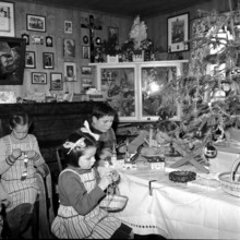 Farmer family celebrating christmas; 1960.