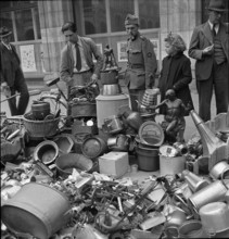 Collect of of non-ferrous metal; pile of metal articles; 1942.