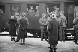 Soldiers saying goodbye; probably 1940.