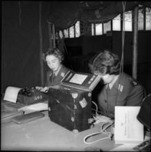 Women soldiers writing, Muba Basel 1955.