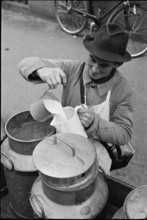 Milkman delivering milk; 1941.