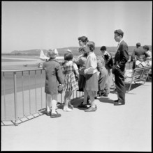 Gerold Zust with Hungarian children at airport Kloten 1957.