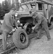 Changing a wheel on vehicle on rails 1952.