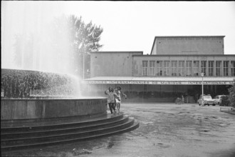 Two women beside a fountain near Culture and Convention Centre Lucerne; 1965.
