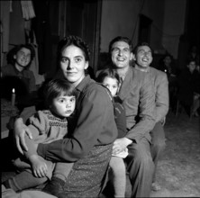 Parents celebrating Christmas with children, 1952.