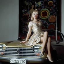 Ines Torelli on Peugeot 204.
