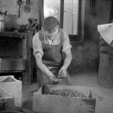 Forge, nailer making nails; 1940.