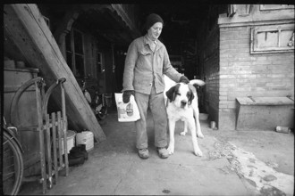 Man with dog in the Emmental, 1970.