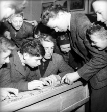 Boys are counting coins.