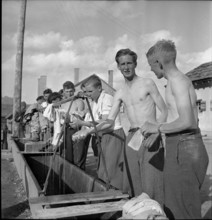Young men washing themselves.
