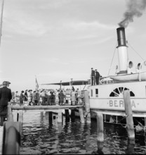 People getting into a steamer; 1955.
