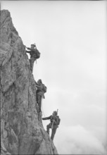 Rope of three soldiers climbing, Furka 1950.