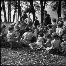 Women soldiers looking after children in vacation camp 1961.