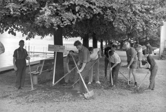 Inhabitants of Arth cleaning lakeside walk near Lake Zug 1970.