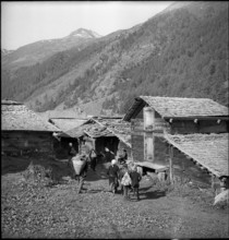 Farmers meet for cheese donation in the Turtmanntal valley, Switzerland, 1940.